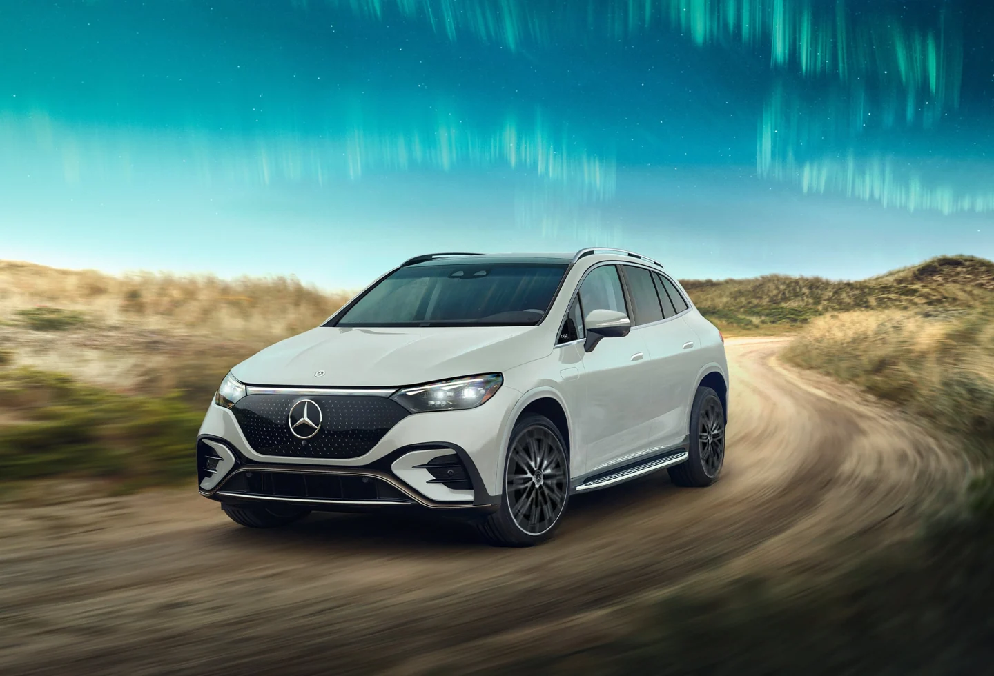 White Mercedes-Benz EQE SUV seen from the front three-quarter angle.