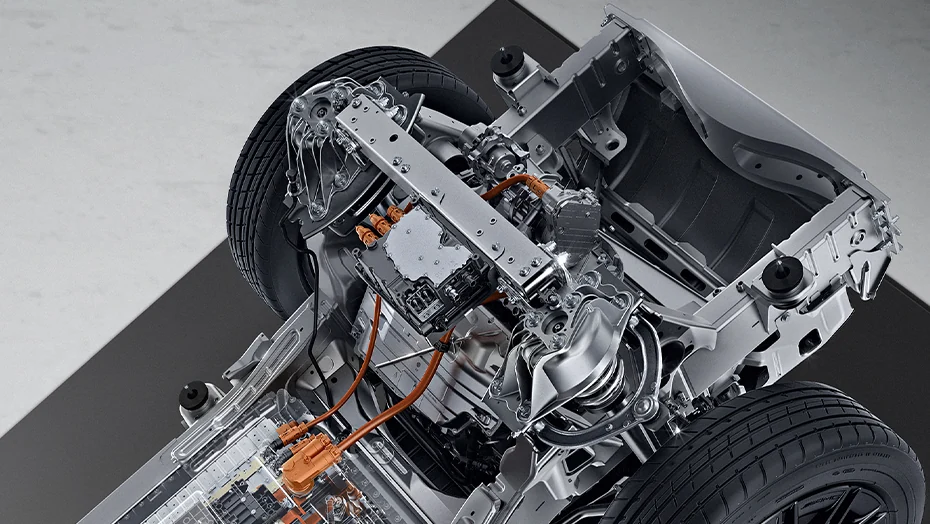 Mercedes-Benz G 580 Electric chassis illustration showing axle-mounted drive hardware and orange high-voltage cables.