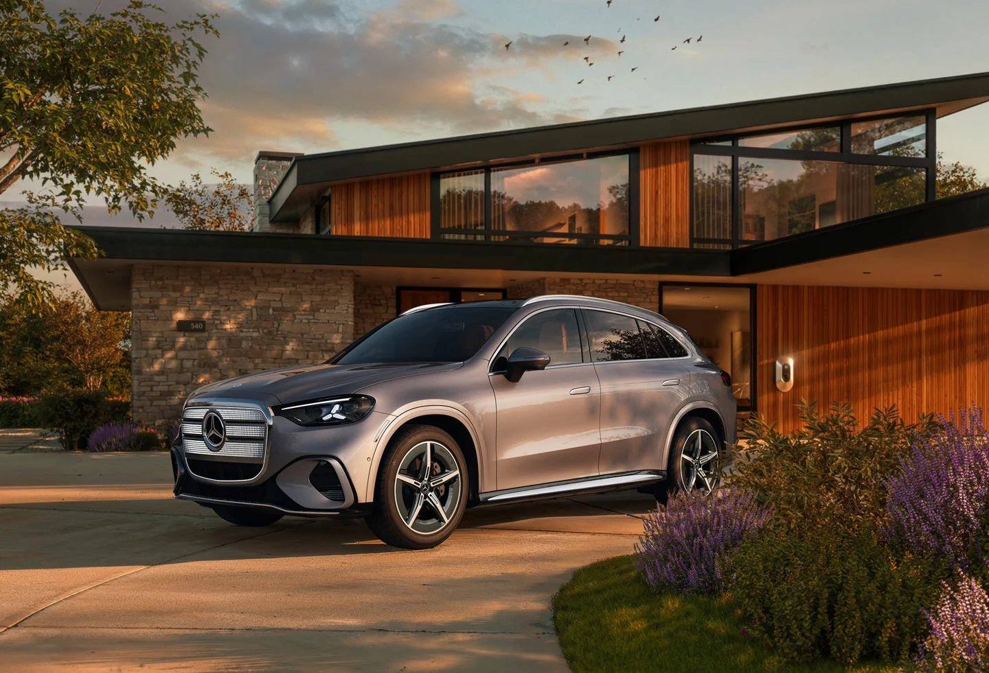 Mercedes-Benz GLC Electric SUV parked outside a home.